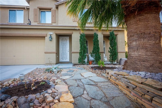 property entrance featuring a garage