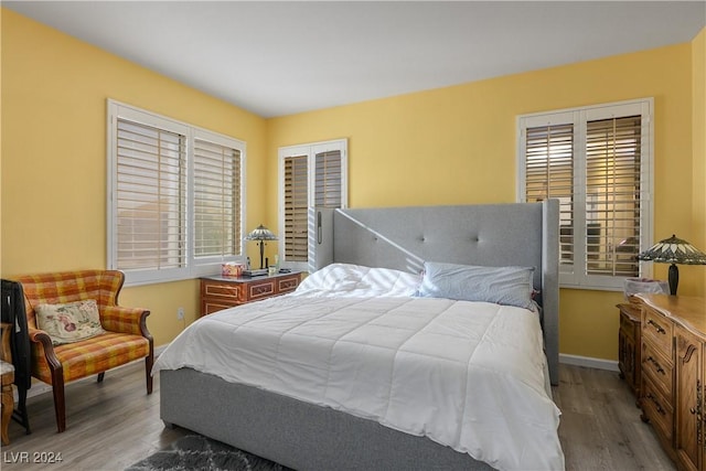 bedroom with hardwood / wood-style flooring