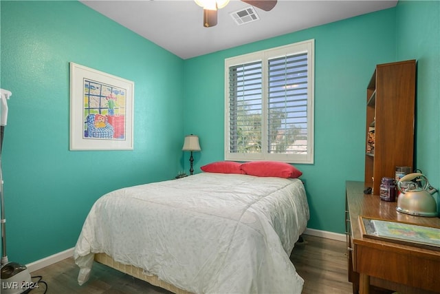 bedroom featuring ceiling fan and dark hardwood / wood-style flooring