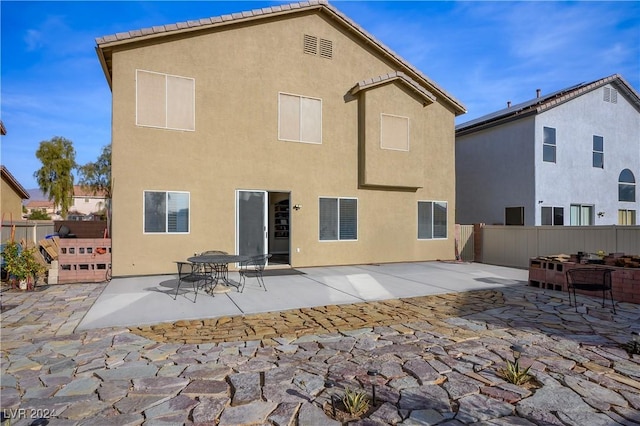 back of house featuring a patio area