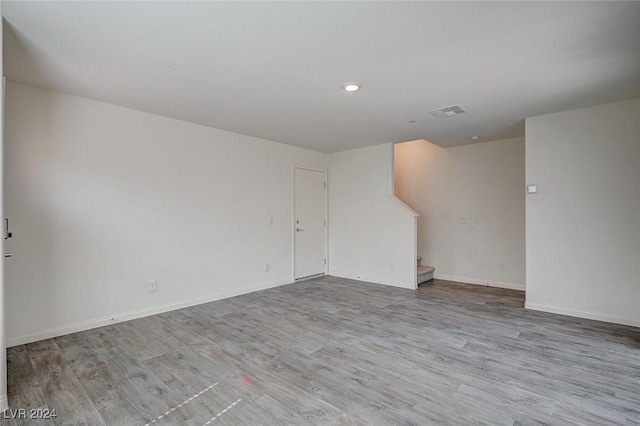 spare room with light hardwood / wood-style floors