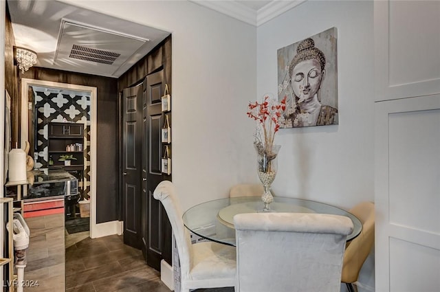 dining space with ornamental molding