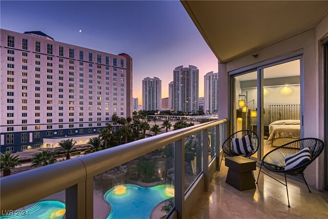 view of balcony at dusk