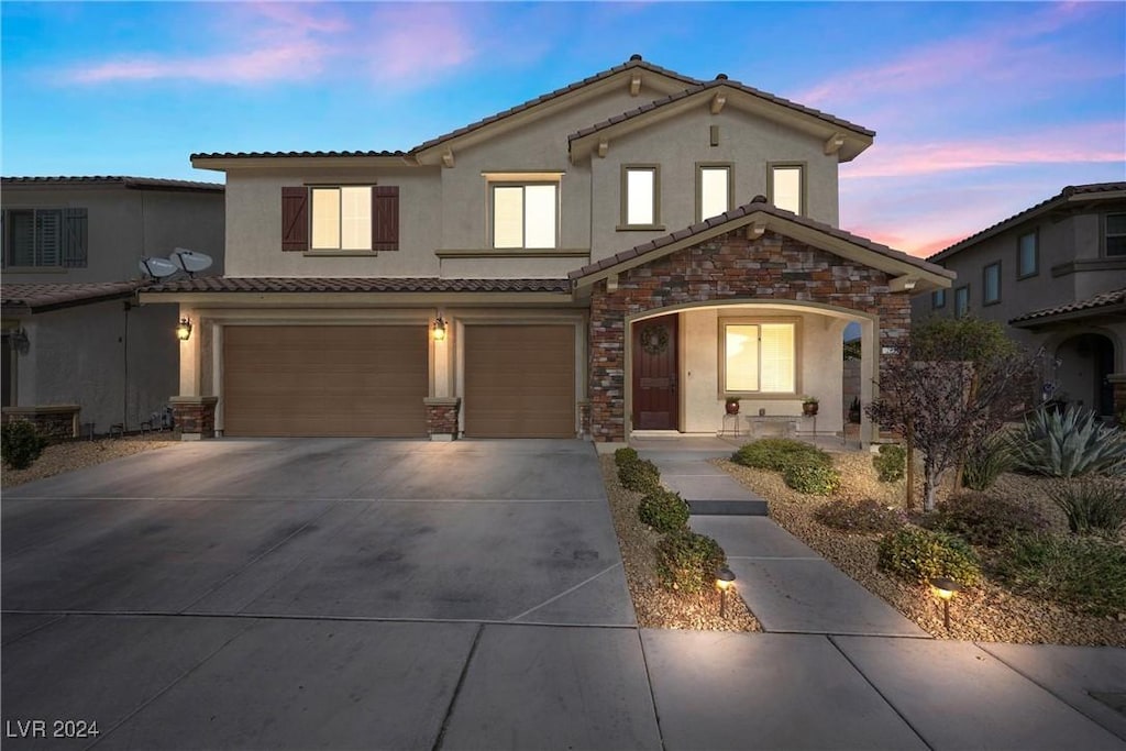 view of front of home with a garage