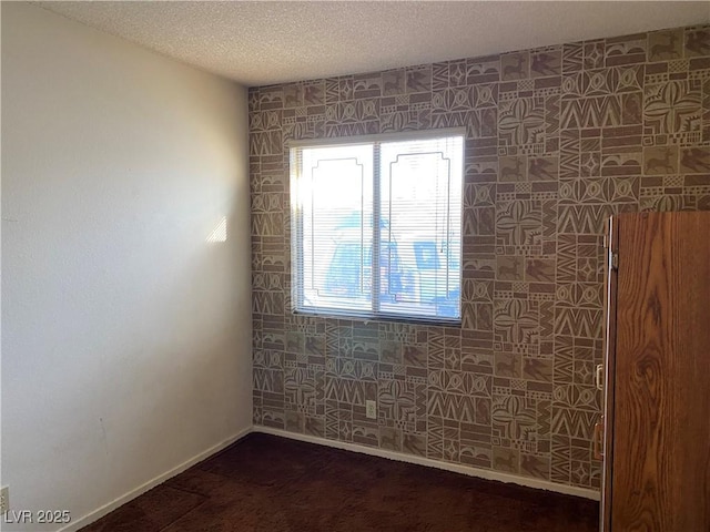 empty room with a textured ceiling