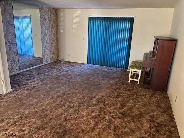 interior space with dark colored carpet