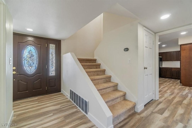 entryway with light hardwood / wood-style flooring