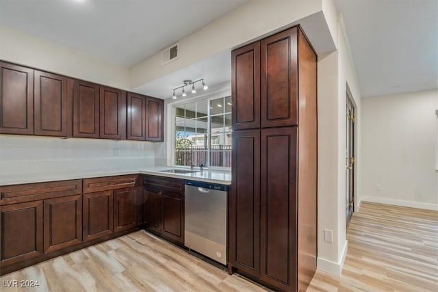 kitchen with dishwasher, light hardwood / wood-style floors, and sink