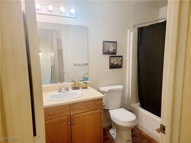 bathroom featuring shower / bath combo, vanity, and toilet