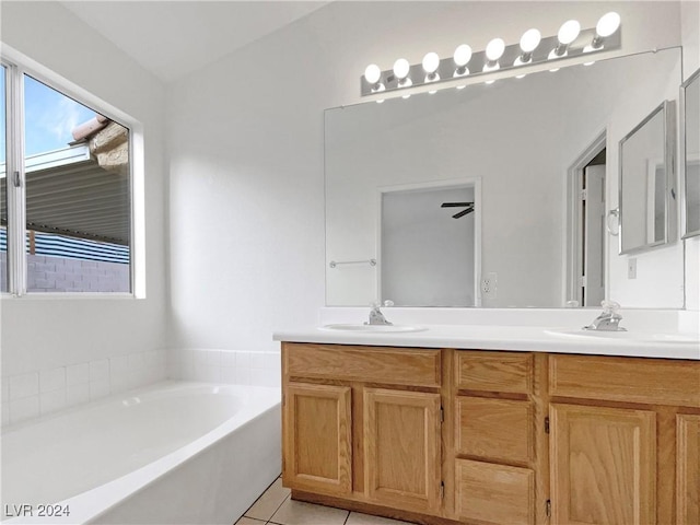 bathroom featuring vanity, ceiling fan, tile patterned flooring, and a bathtub