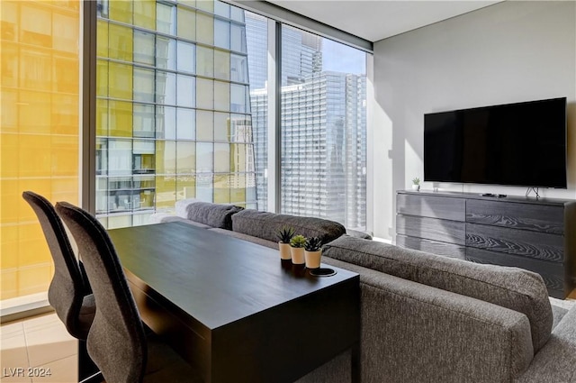 office space with tile patterned flooring, expansive windows, and a healthy amount of sunlight