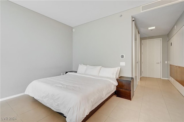 bedroom featuring light tile patterned flooring