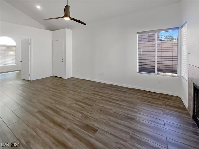 unfurnished room featuring ceiling fan, dark hardwood / wood-style floors, and lofted ceiling