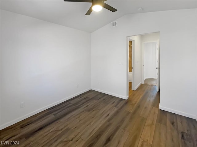 spare room with dark hardwood / wood-style flooring, ceiling fan, and lofted ceiling