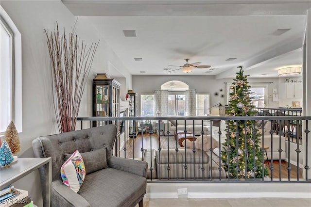 living area featuring ceiling fan