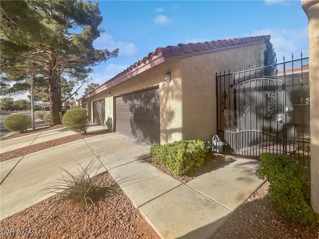 view of home's exterior with a garage