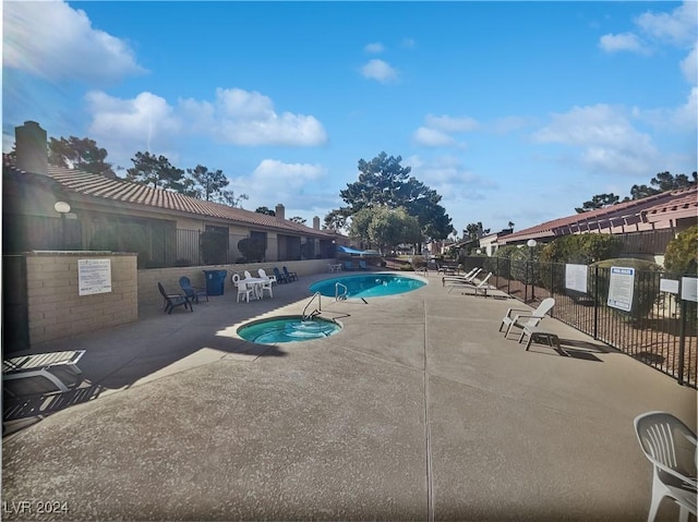 view of pool featuring a patio