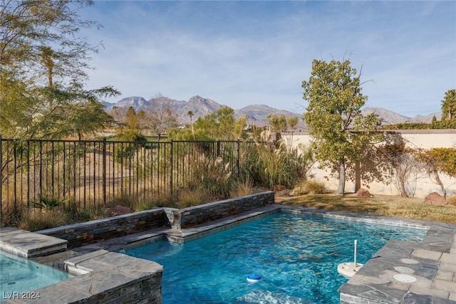 view of pool featuring a mountain view