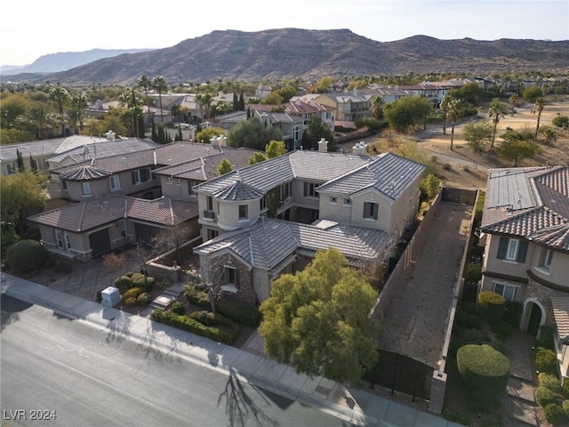 birds eye view of property featuring a mountain view