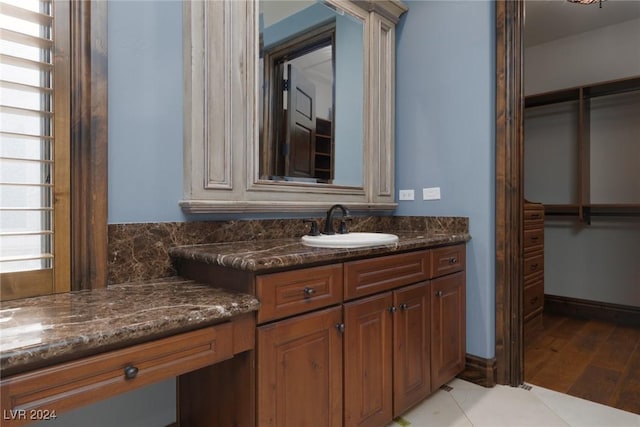 bathroom with tile patterned floors and vanity