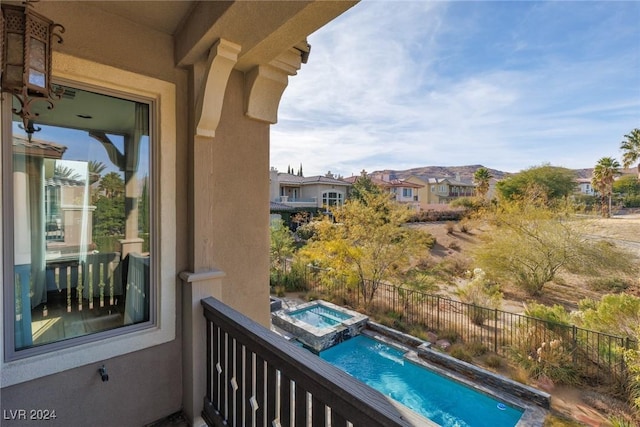 balcony with an in ground hot tub