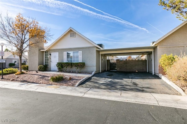 single story home with a carport