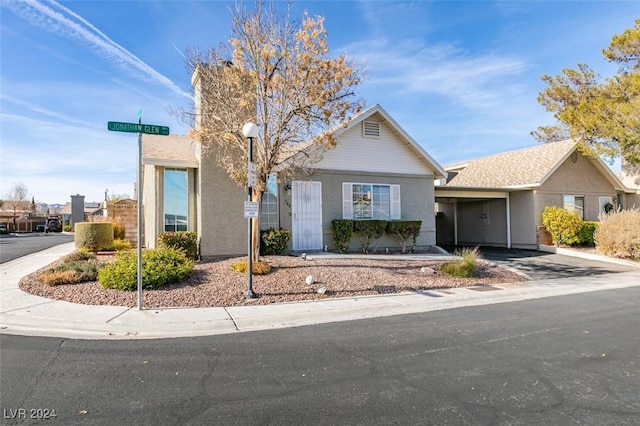 view of front of property with a carport