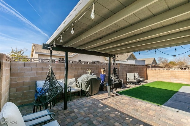 view of patio featuring a grill