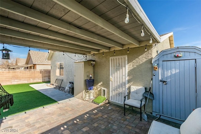 view of patio with a shed