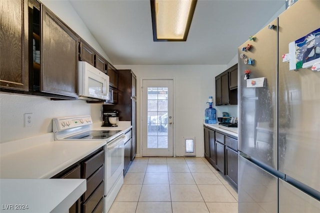 kitchen with stainless steel appliances, dark brown cabinets, and light tile patterned floors