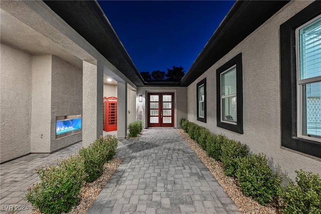 exterior entry at night with french doors