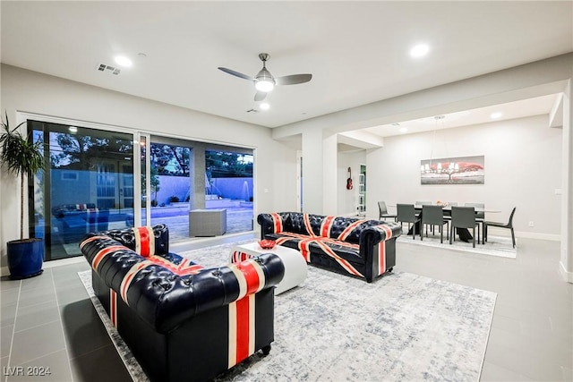 tiled living room with ceiling fan