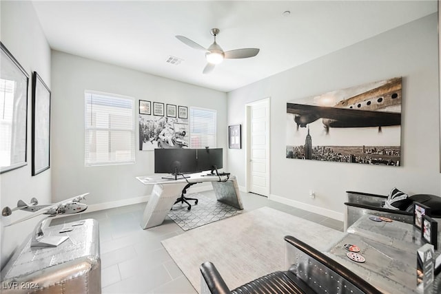 tiled home office with ceiling fan