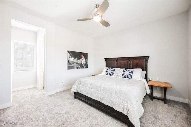 bedroom with ceiling fan and light colored carpet