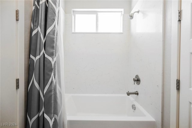 bathroom featuring shower / bathtub combination with curtain