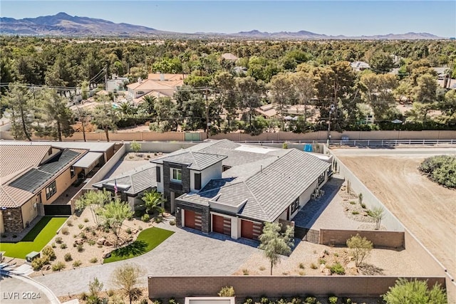 birds eye view of property featuring a mountain view