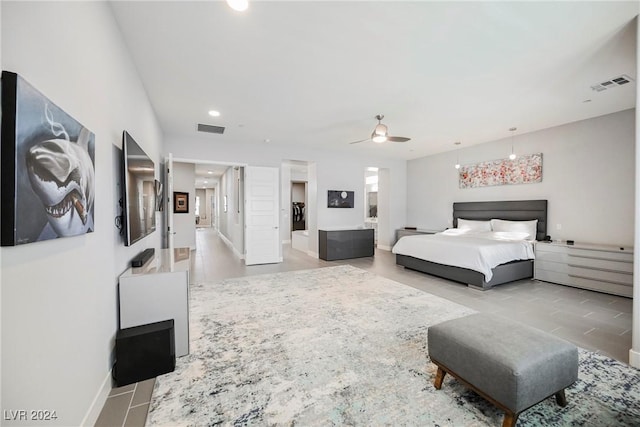 tiled bedroom featuring ceiling fan