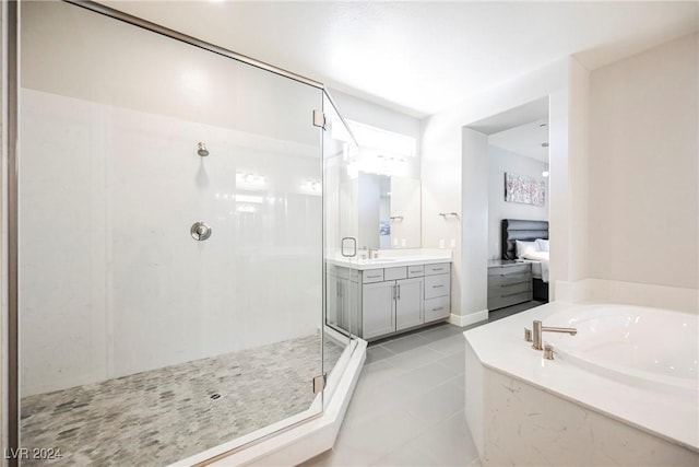 bathroom featuring vanity, tile patterned floors, and independent shower and bath