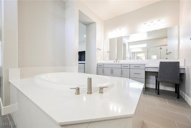 bathroom with tile patterned floors, vanity, and a shower with shower door