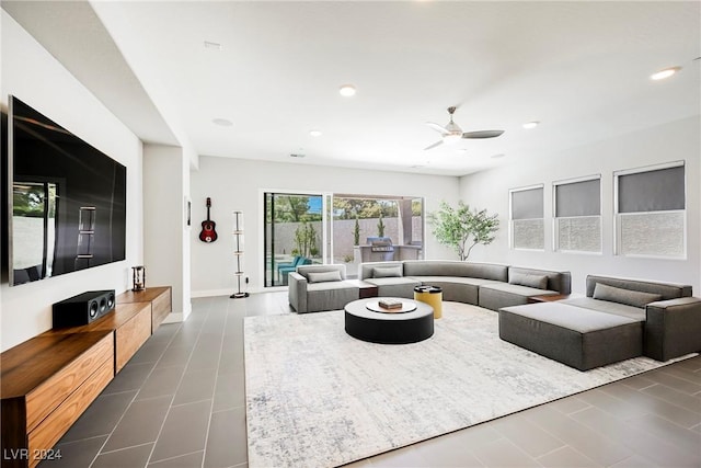 tiled living room featuring ceiling fan