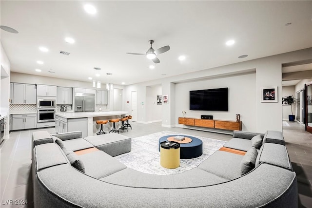 living room featuring ceiling fan