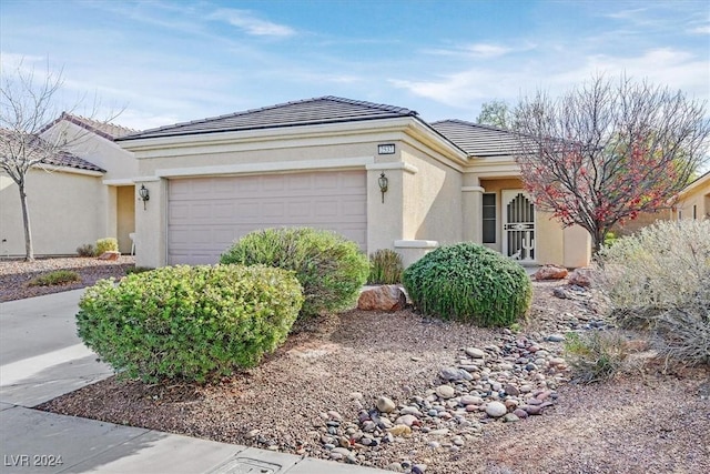 single story home with a garage