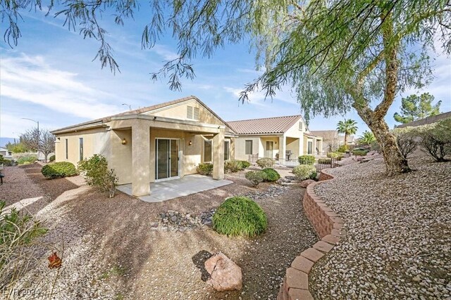 rear view of property with a patio