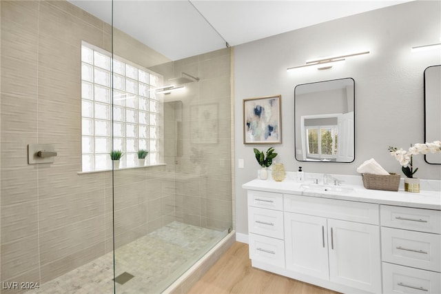 bathroom featuring a healthy amount of sunlight and a tile shower