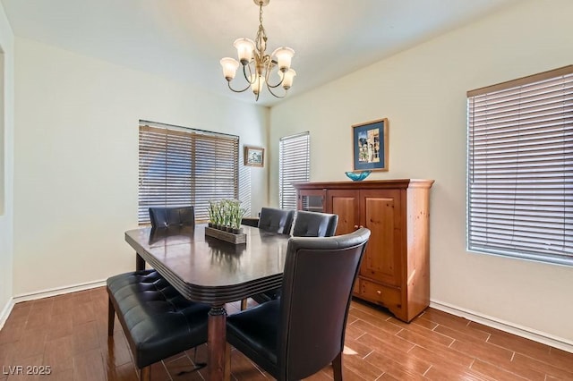 dining room with a notable chandelier