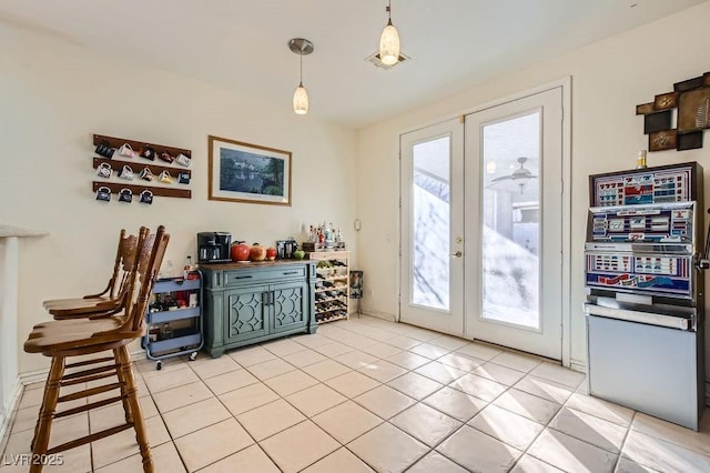 doorway featuring plenty of natural light, french doors, and light tile patterned flooring