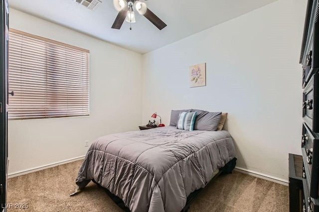 bedroom with baseboards, visible vents, ceiling fan, and carpet flooring