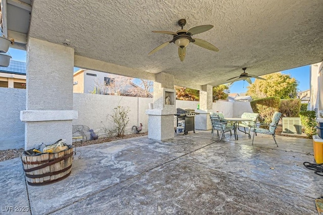 6019 Orca Lilly St, North Las Vegas, NV 89031 - view of patio with a grill, ceiling fan, a fenced backyard, and outdoor dining space