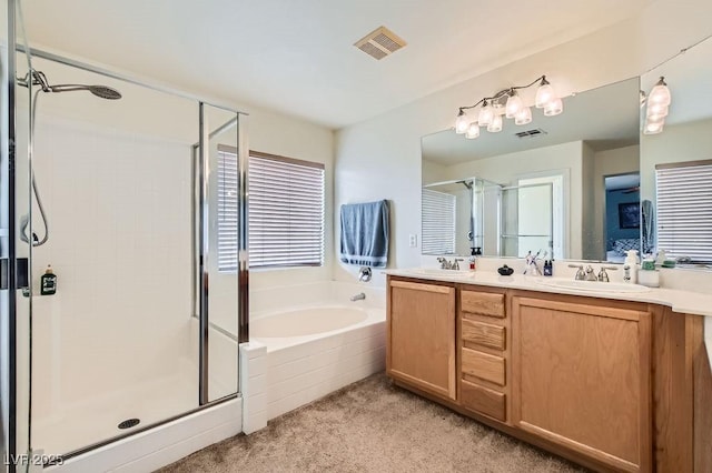 bathroom with separate shower and tub and vanity