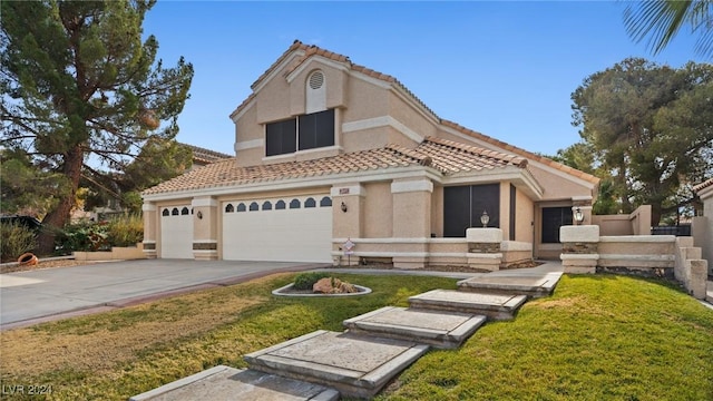 mediterranean / spanish house with a front yard and a garage